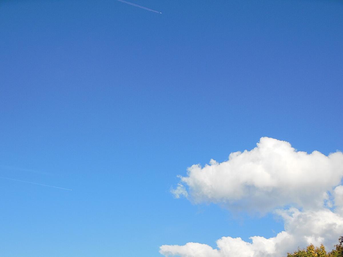 Blue sky with scattered white clouds